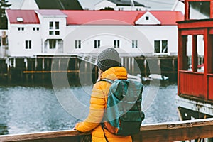 Woman with backpack traveling in Norway sightseeing Travel Lifestyle concept adventure