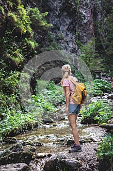 Tourist hiking in mountain trail