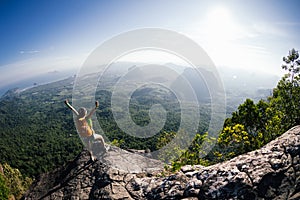 Woman with backpacker enjoy the view on mountain top