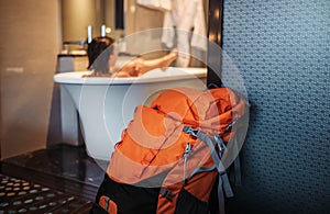 Woman backpacker traveler take a bath in high quality hotel