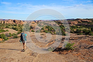 Woman backpacking in desert southwest landscape