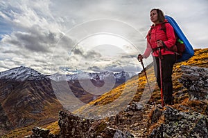 Woman Backpacking in Scenic Mountain Landscape