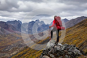 Woman Backpacking on Scenic Rocky Hiking Trail photo