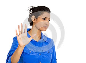 Woman with bad attitude giving talk to the hand gesture with palm outward
