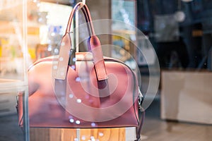 woman bag on store showcase window with bokeh light and no people background