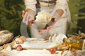 Woman baker hands,pizza kneads dough and making housework making bread, butter, tomato flour