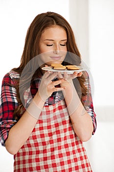 Woman baking cookies in the kitchen