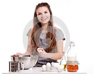 Woman baking at home following recipe