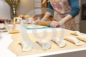 Woman baking pies in her home kitchen