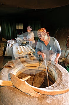 Woman baking traditional Georgian bread