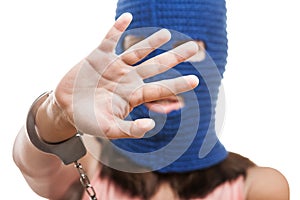 Woman in balaclava hiding face photo