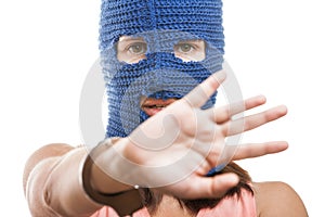 Woman in balaclava hiding face photo