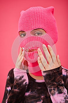 Woman in balaclava with se