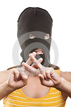 Woman in balaclava showing prison gesture