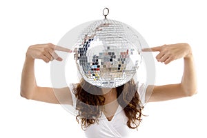 Woman balancing mirror ball with fingers