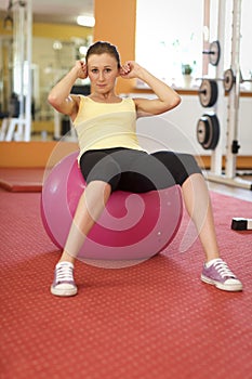 Woman Balancing On Swiss Ball