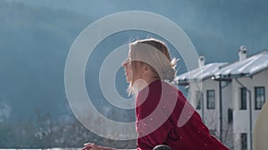 Woman on balcony at morning.