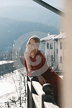 Woman on balcony at morning.