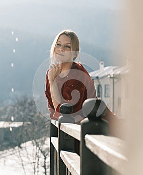 Woman on balcony at morning.