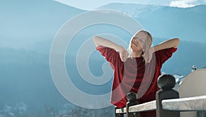 Woman on balcony at morning.