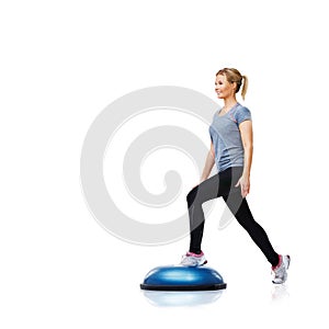 Woman, ball or legs training in workout for body or core development isolated on white background. Athlete, exercise