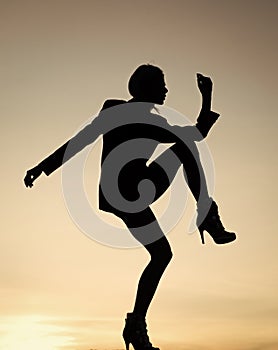 Woman ballet dancer dancing silhouette evening sky, girl