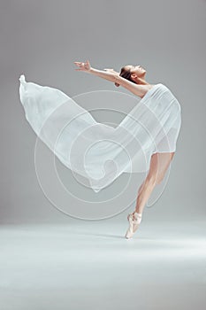 Woman, ballet and fabric with fitness in studio for dancing, balance and performance or art. Female dancer, contemporary