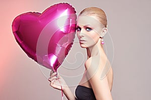 Woman with balloon heart.make-up