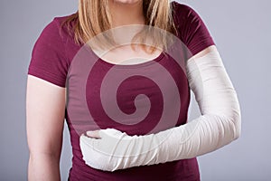 Woman with bandaged arm photo