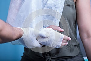 Woman with bandaged hand