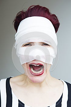 Woman in bandages screaming