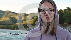 Woman on the bank of the mountain river Katun