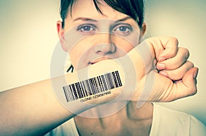 Woman with barcode on her hand - genetic clone concept