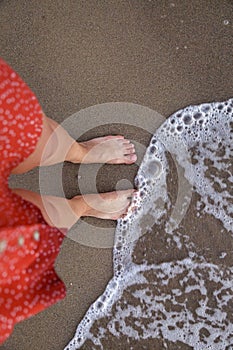 Woman Bare Feet on the Beach