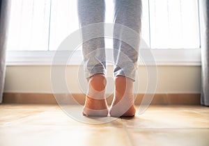 Woman bare feet walking on floor