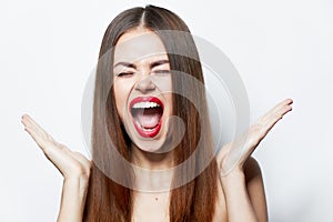 Woman with bare shoulders Aggressive mouth wide open spa treatments