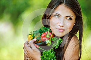 Woman with bare shoulders holding