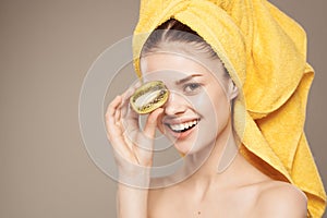 woman bare shoulders kiwi fruit vitamins skin care