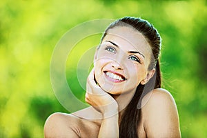 Woman with bare shoulders laughs