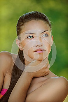 Woman with bare shoulders looked