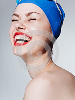 woman with bare shoulders swimming goggles red lips sport fitness