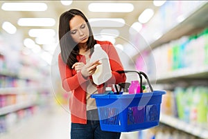Woman with basket full of cleansers