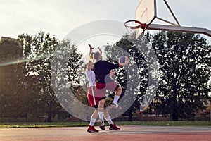 Woman basketball player have treining and exercise at basketball court at city on street