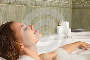 Woman in bath relaxing photo
