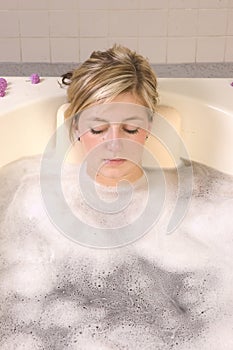 Woman in bath resting photo