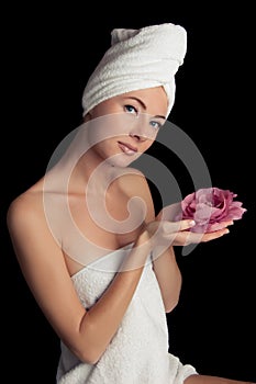 Woman after bath with towel and flower