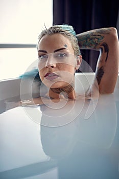 Woman is bathing in bathtub
