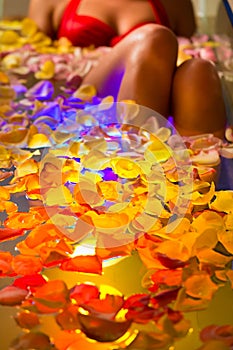 Woman bathing in spa with color therapy