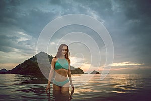 Woman bathing in tropical sea in her beach vacation