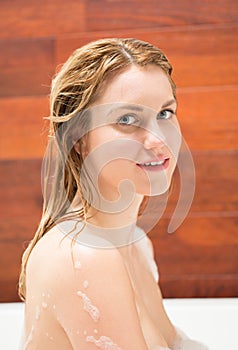 Woman bathing in the tub